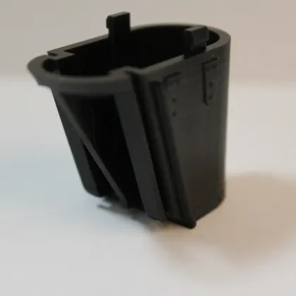 A black enclosure housing part