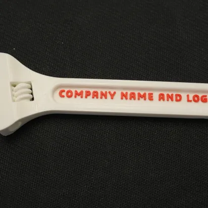 A customizable promotional wrench printed with a company name and logo